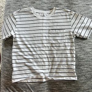 selling bc doesn’t fit. Size Small, black and white striped, good condition.